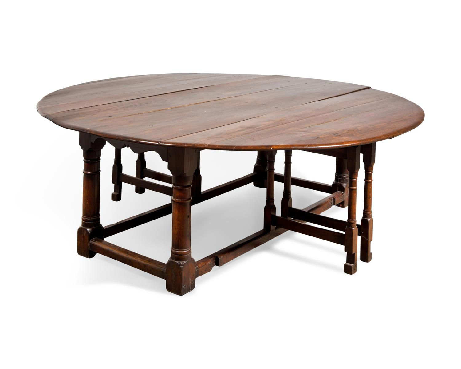 A Large Baroque Style Oak Drop-Leaf Dining Table