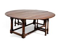A Large Baroque Style Oak Drop-Leaf Dining Table