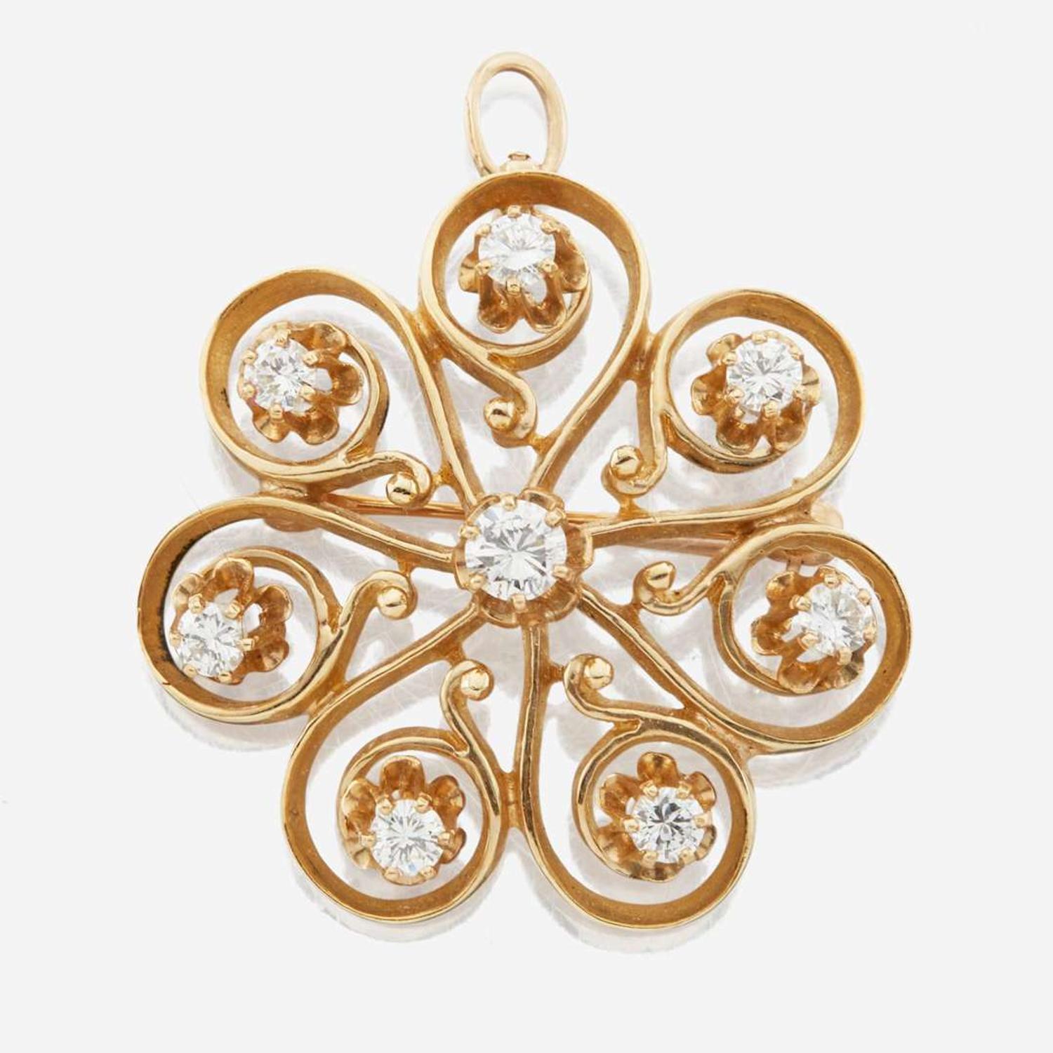 A 14K yellow gold and diamond pendant/brooch