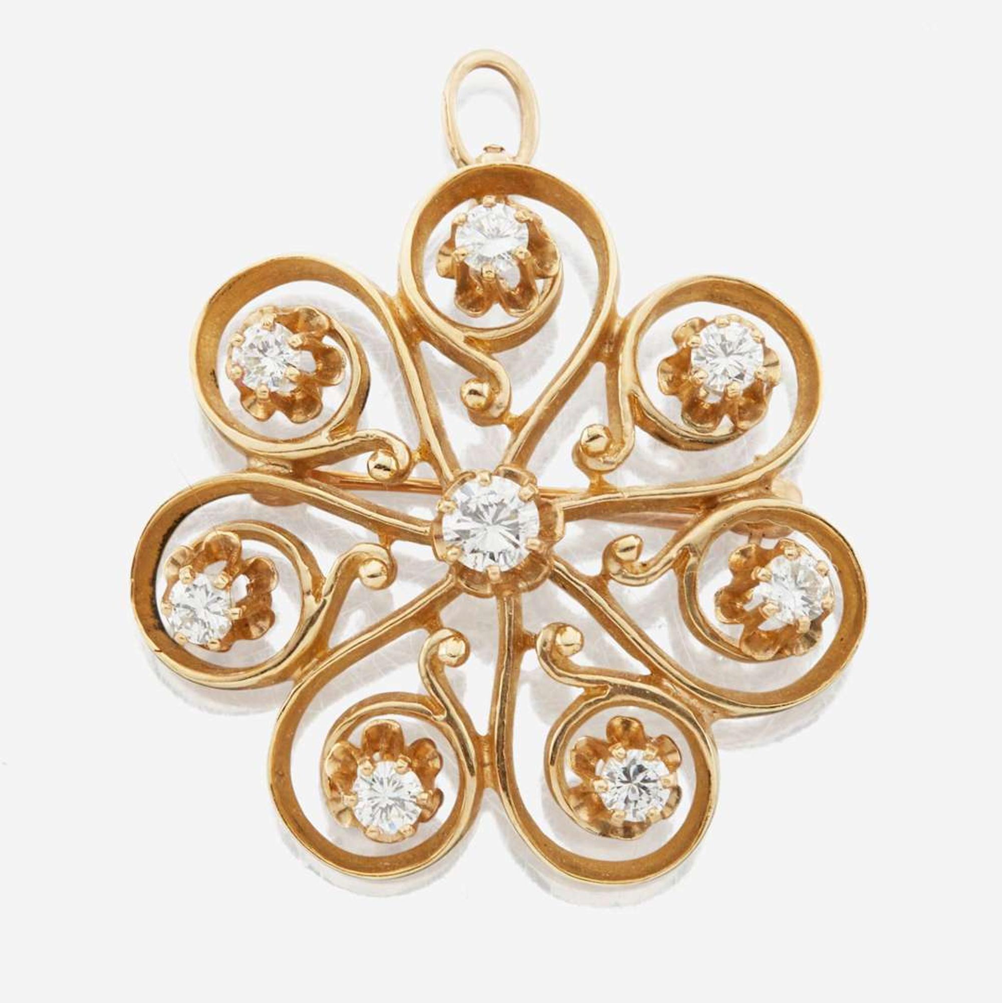 A 14K yellow gold and diamond pendant/brooch