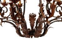 A Pair of Spanish Iron and Tole Eight-Light Chandeliers