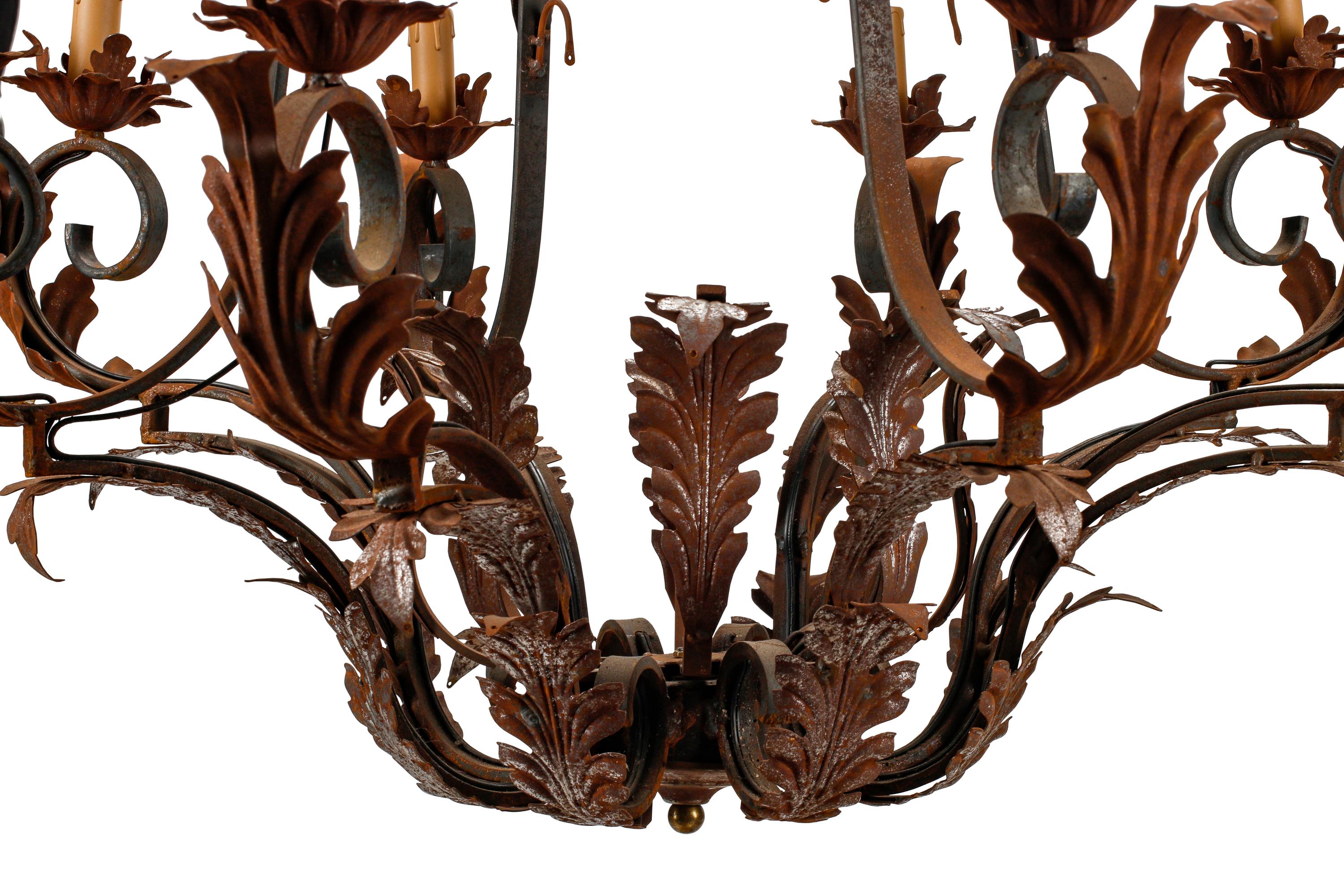 A Pair of Spanish Iron and Tole Eight-Light Chandeliers