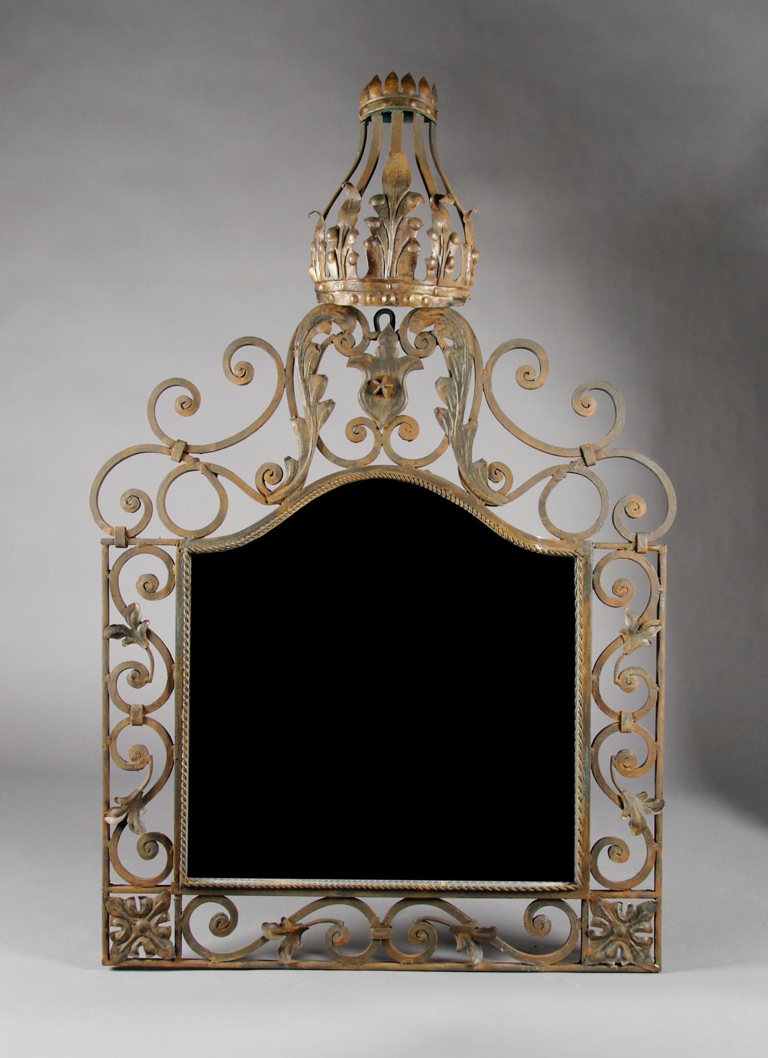 A Wrought Iron Framed Mirror, Height 53 x width 34 inches.