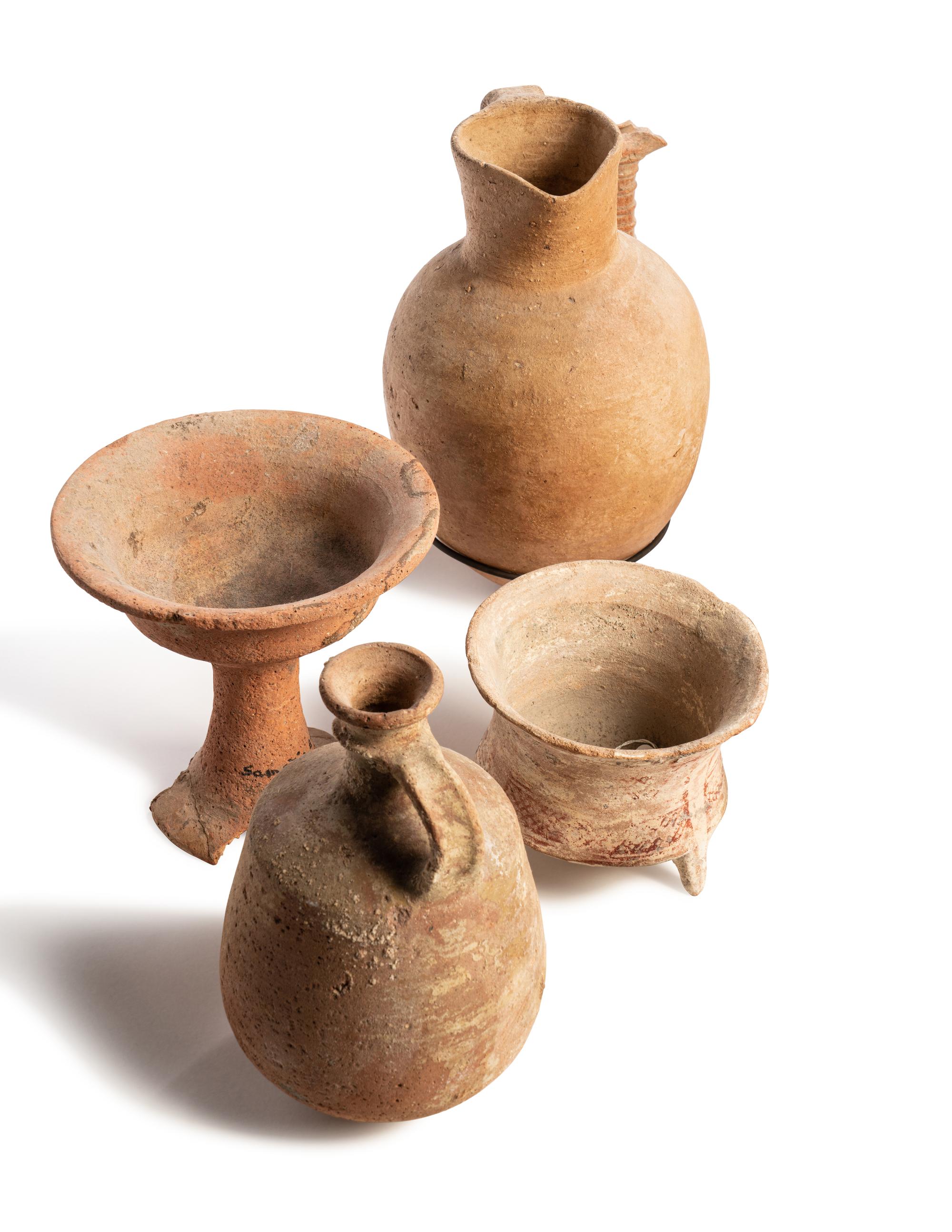 A Group of 19 Holy Land Terracotta Oil Lamps, Pottery, and Bronze Blades
