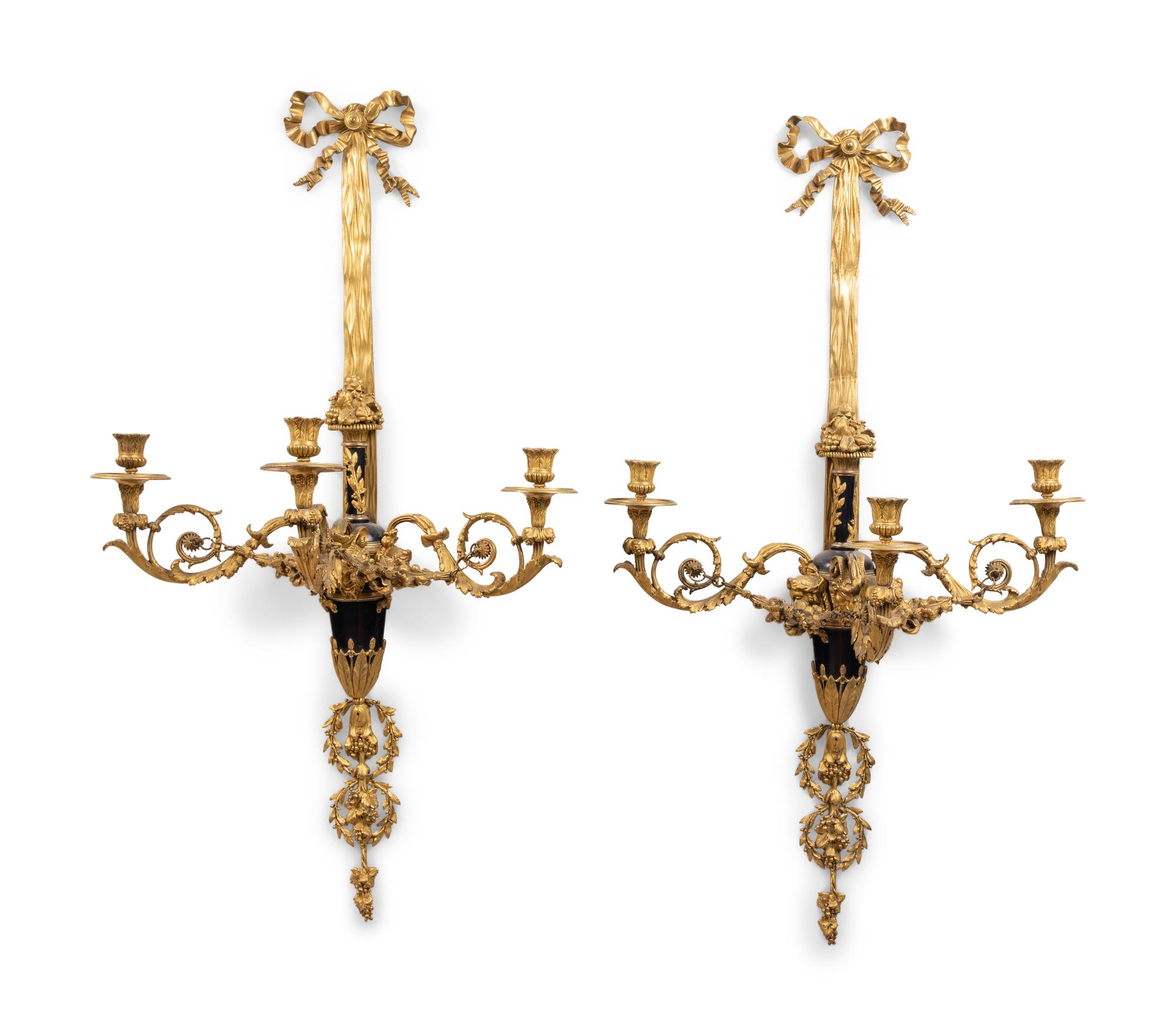 A Pair of Louis XVI Style Gilt Bronze Three-Light Wall Sconces