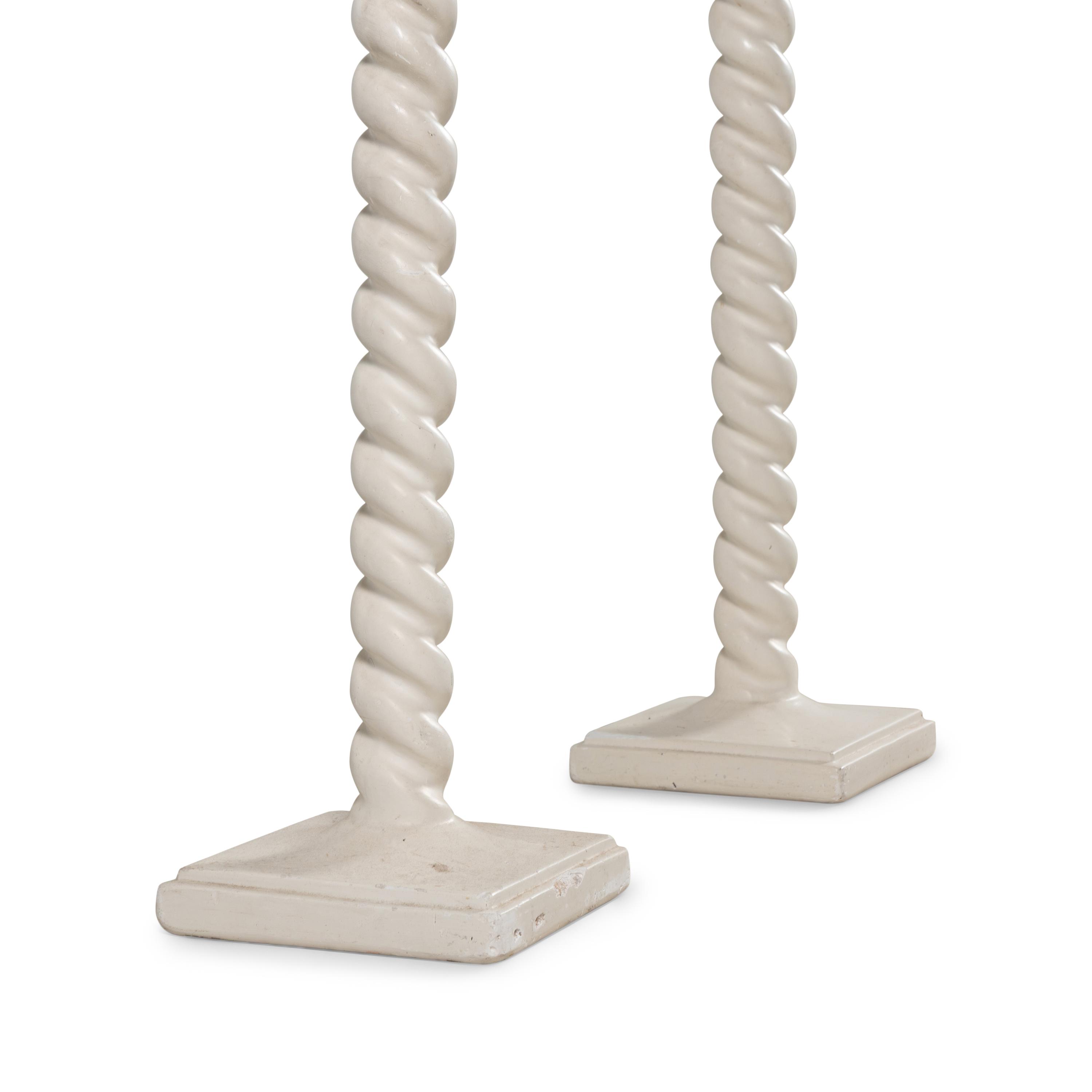 A Pair of White Composition Floor Lamps