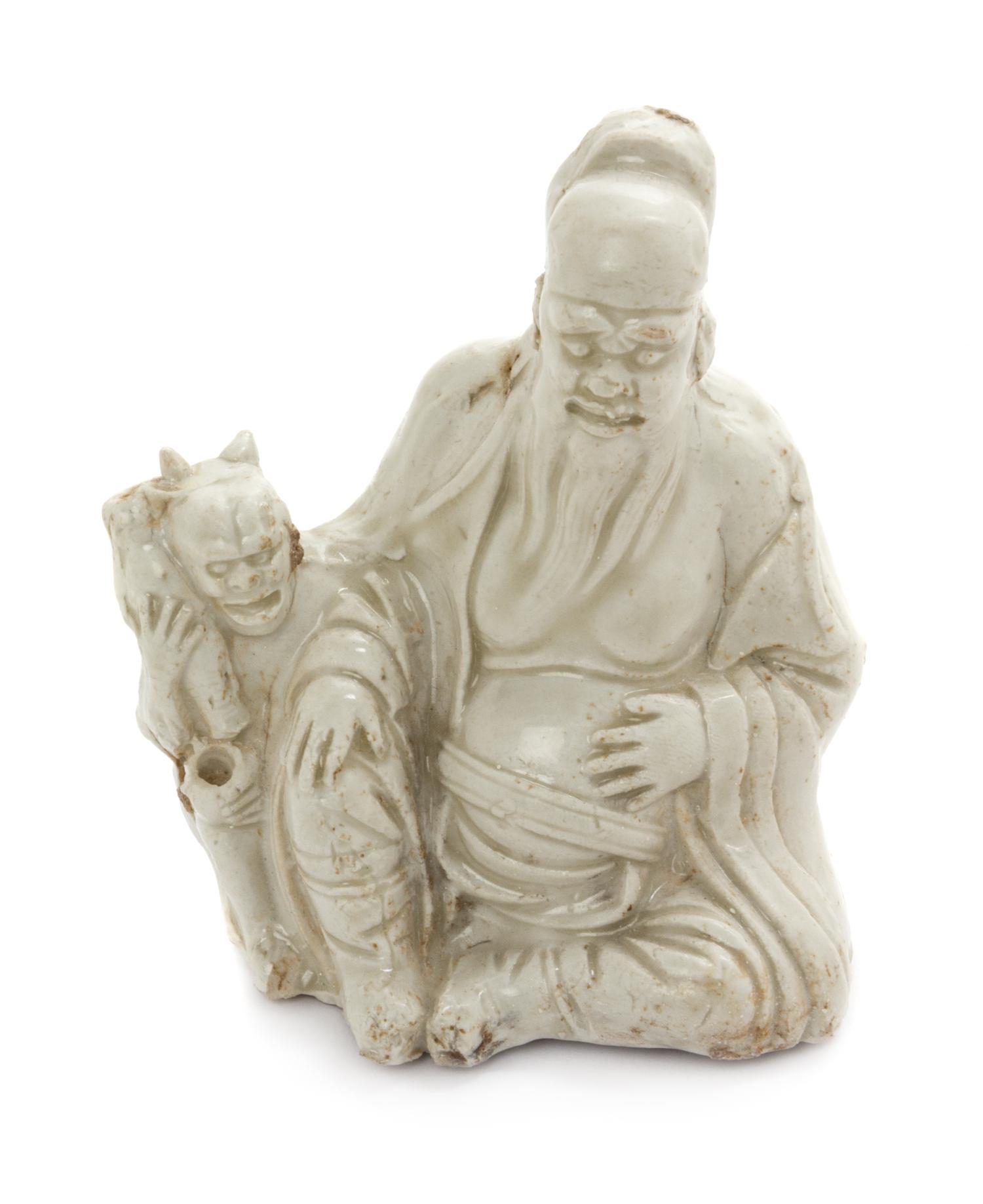 A White Glazed Porcelain Figural Form Vessel Height 4 1/2 inches. — LIAO DYNASTY (916-1125)
