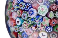 A Baccarat Close Packed Millefiori and Silhouette Glass Paperweight