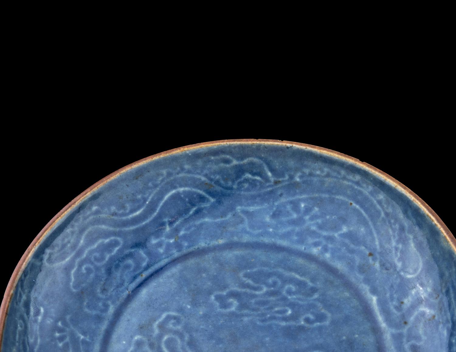 A Carved Blue Glazed Porcelain 'Dragon and Cloud' Plate