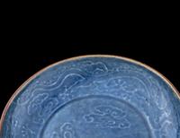 A Carved Blue Glazed Porcelain 'Dragon and Cloud' Plate