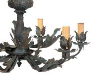 A Rococo Style Patinated Metal Six Light Chandelier