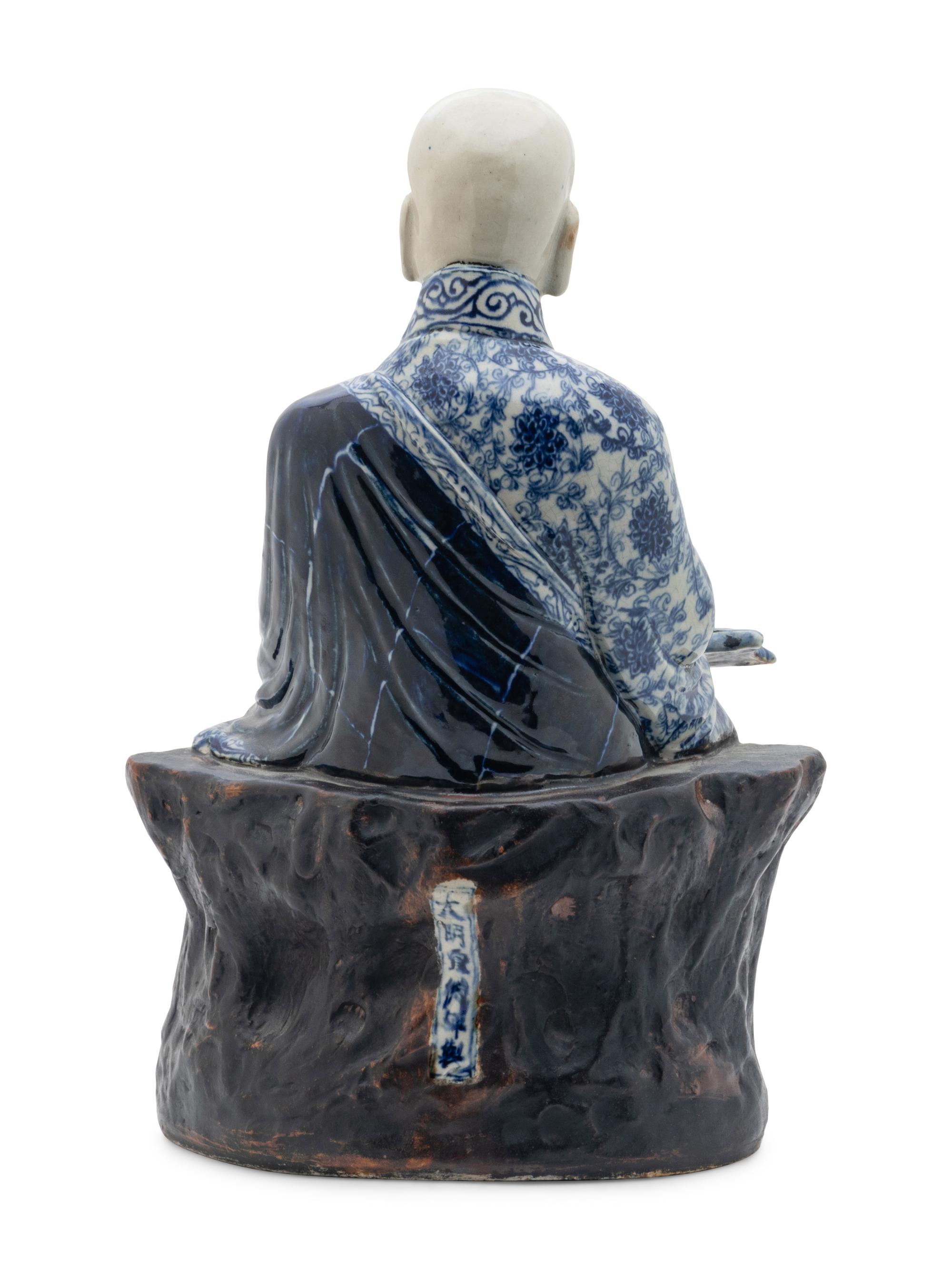 A Chinese Blue and White Ceramic Figure of a Luohan