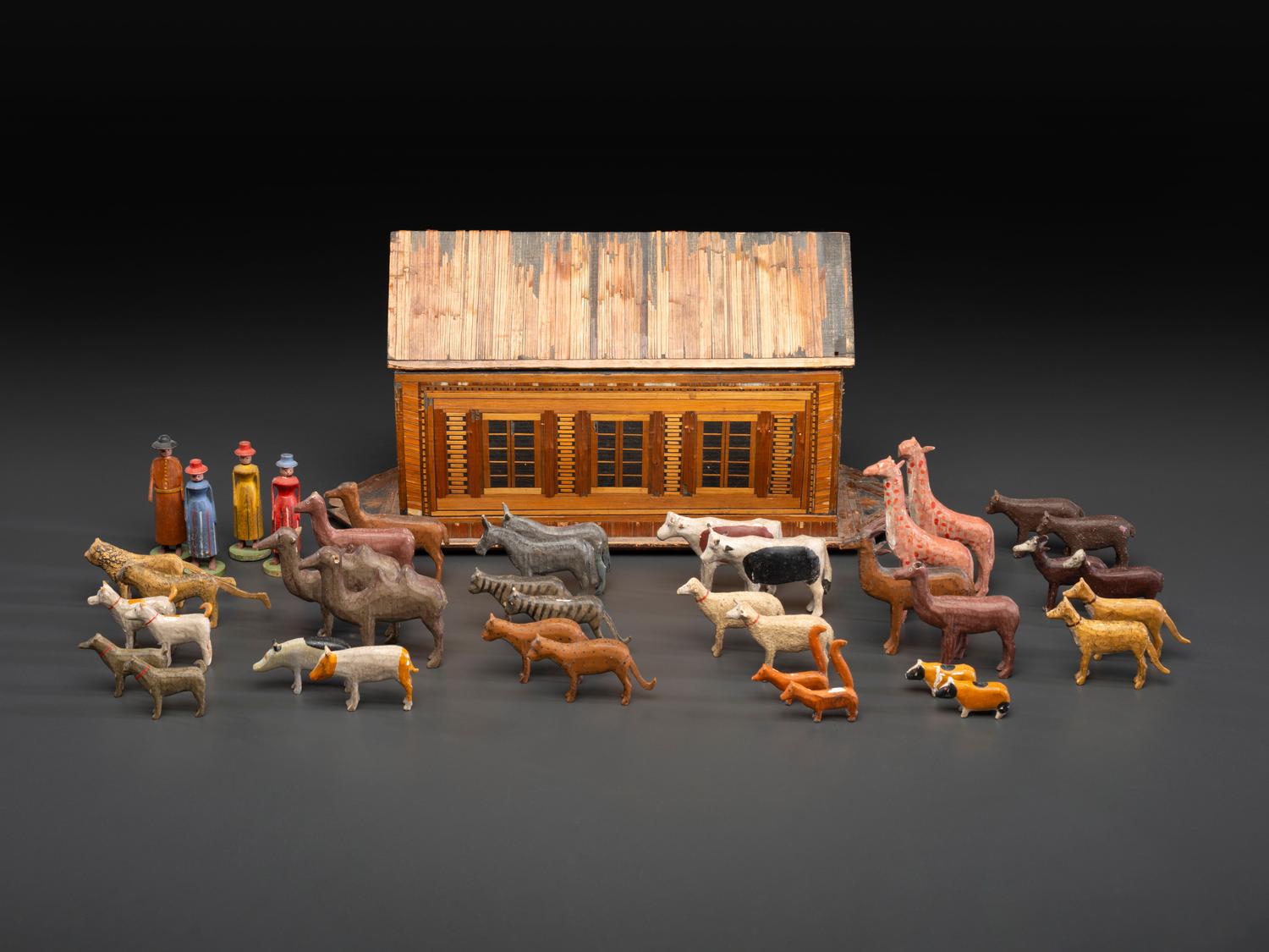 A Carved Wood and Applied Straw Work Noah's Ark with Slide-Front Cover