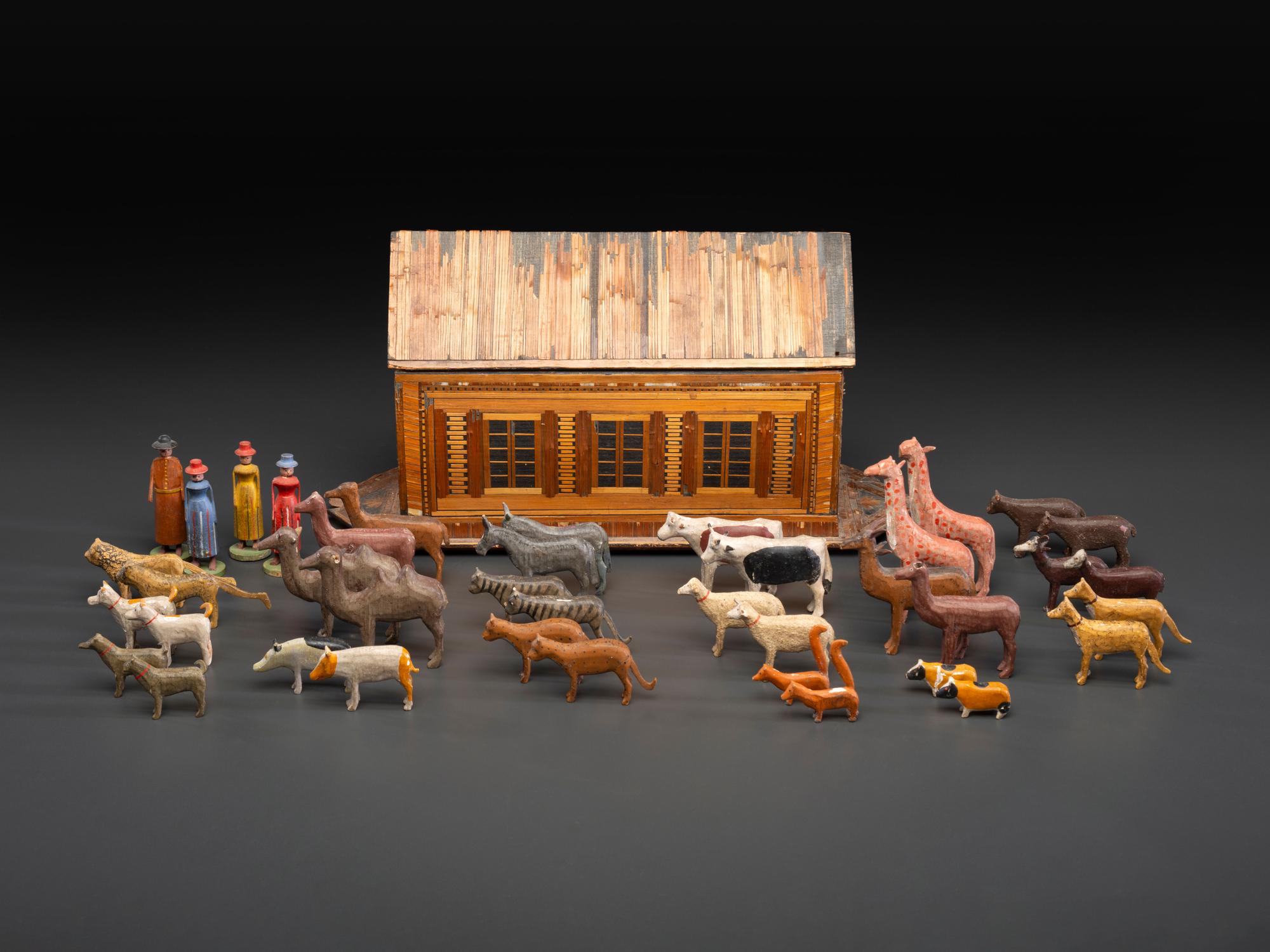 A Carved Wood and Applied Straw Work Noah's Ark with Slide-Front Cover