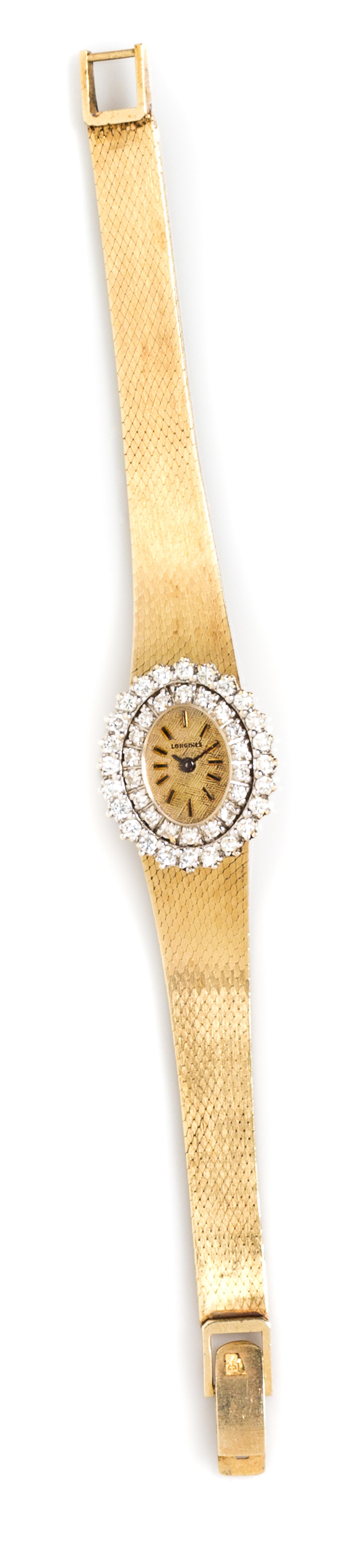 A 14 Karat Yellow Gold and Diamond Wristwatch, Longines, 18.90 dwts.
