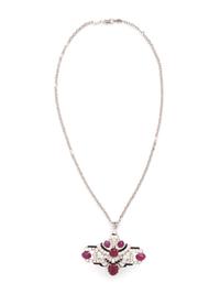 MAUBOUSSIN, ART DECO, CARVED RUBY, DIAMOND, AND BLACK ENAMEL BROOCH