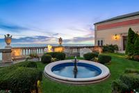 A Brass and Cut Glass Sixteen-Light Chandelier