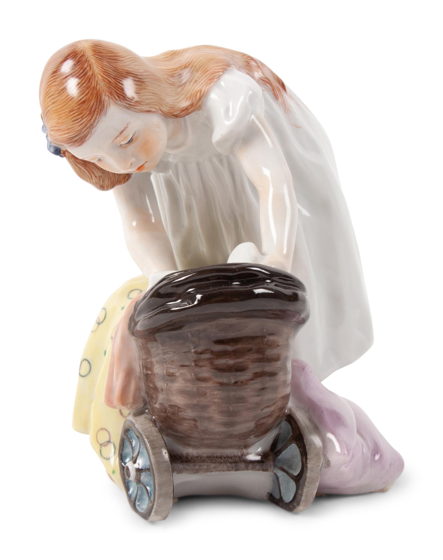 A Meissen Porcelain Figure of a Girl with a Doll Stroller, by Konrad Hentschel