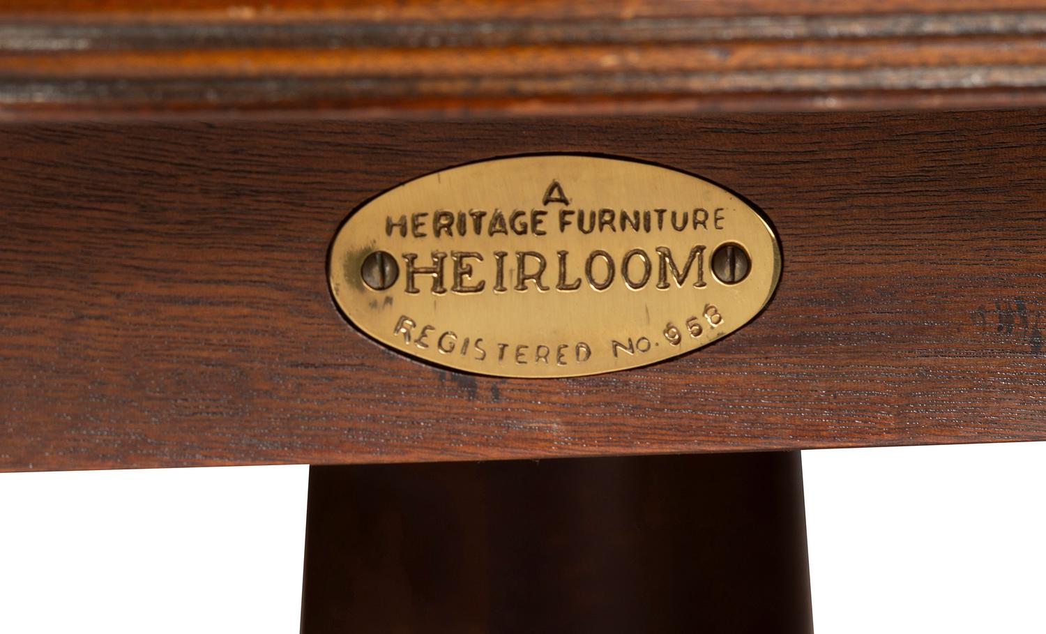 A George III Style Carved Mahogany and Satinwood Dining Table