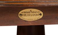 A George III Style Carved Mahogany and Satinwood Dining Table