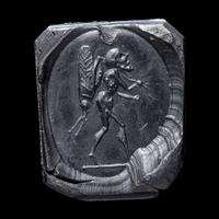 A Roman Sardonyx Ring Stone with a Pygmy and Locust