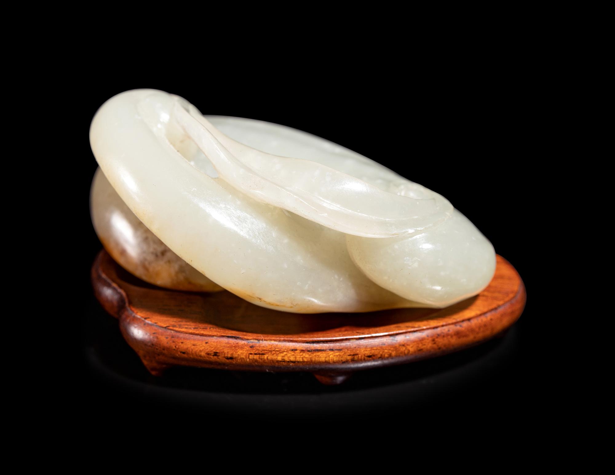 A Pale Celadon and Russet Jade Carving of a Lingzhi Fungus