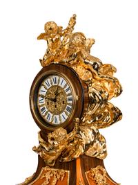 A Louis XVI Style Gilt Bronze Mounted Rosewood and Palisander Parquetry Longcase Clock