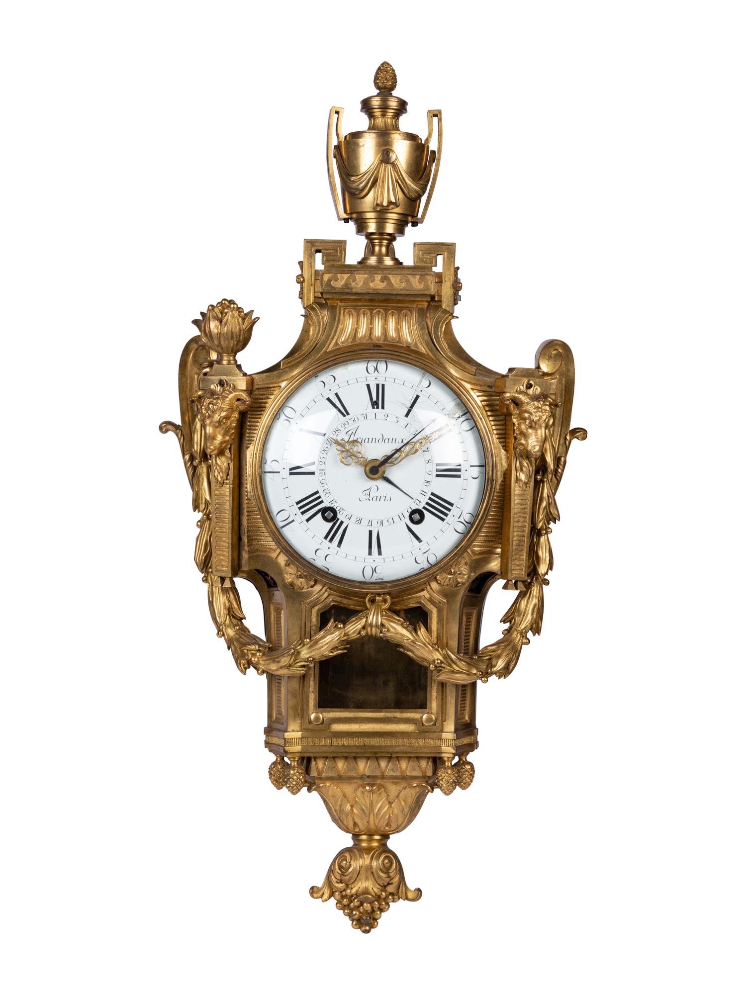 A Louis XVI Gilt Bronze Cartel Clock