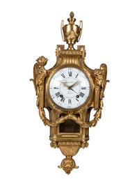 A Louis XVI Gilt Bronze Cartel Clock