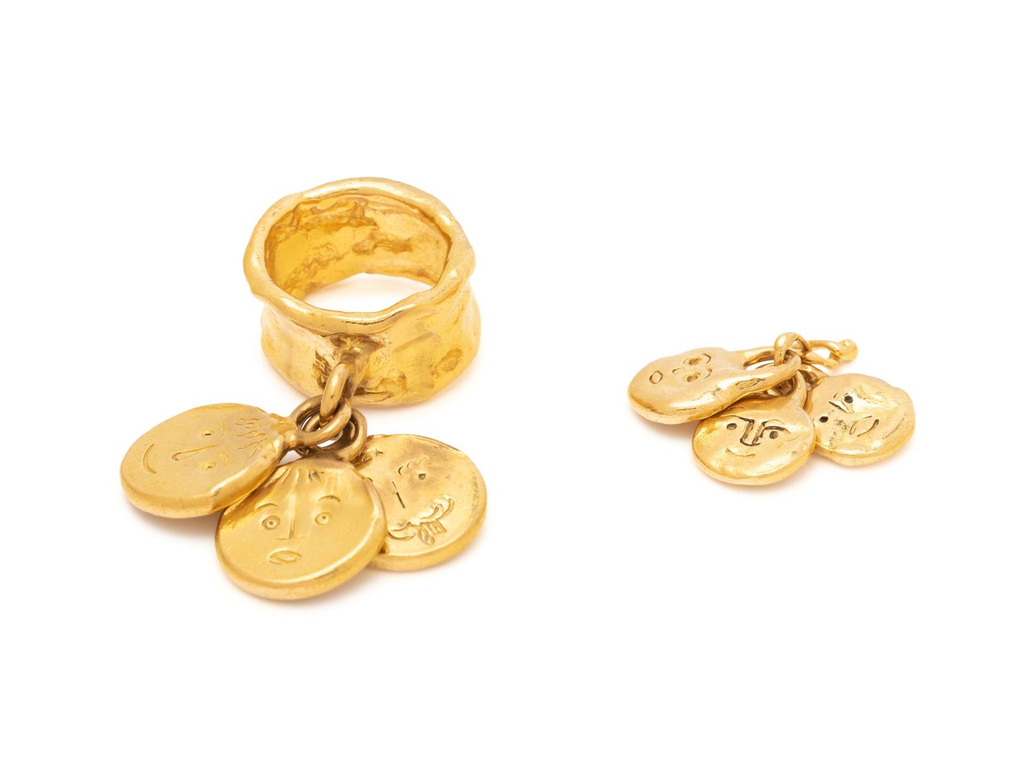 JEAN MAHIE, HIGH KARAT GOLD RING AND CHARM