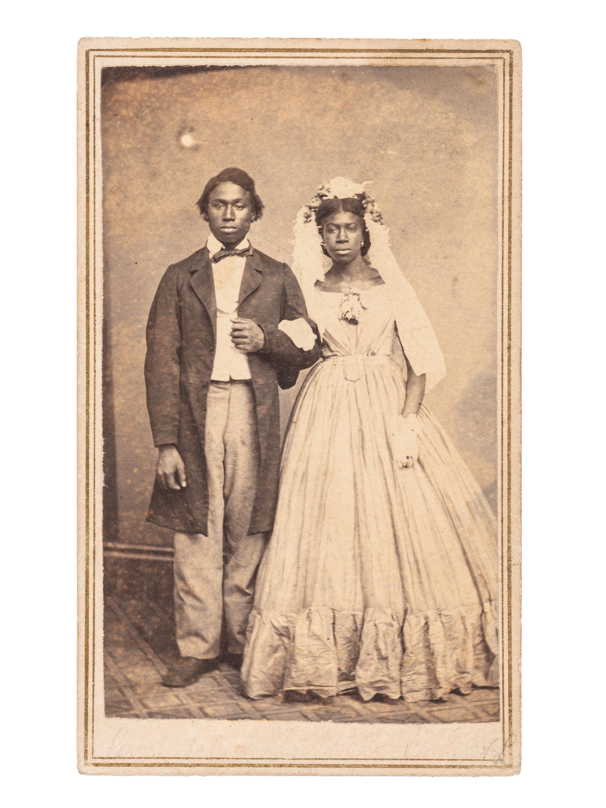 [EARLY PHOTOGRAPHY]. CDV of an African American bride and groom. Quincy, IL: Mrs. W.A. Reed.