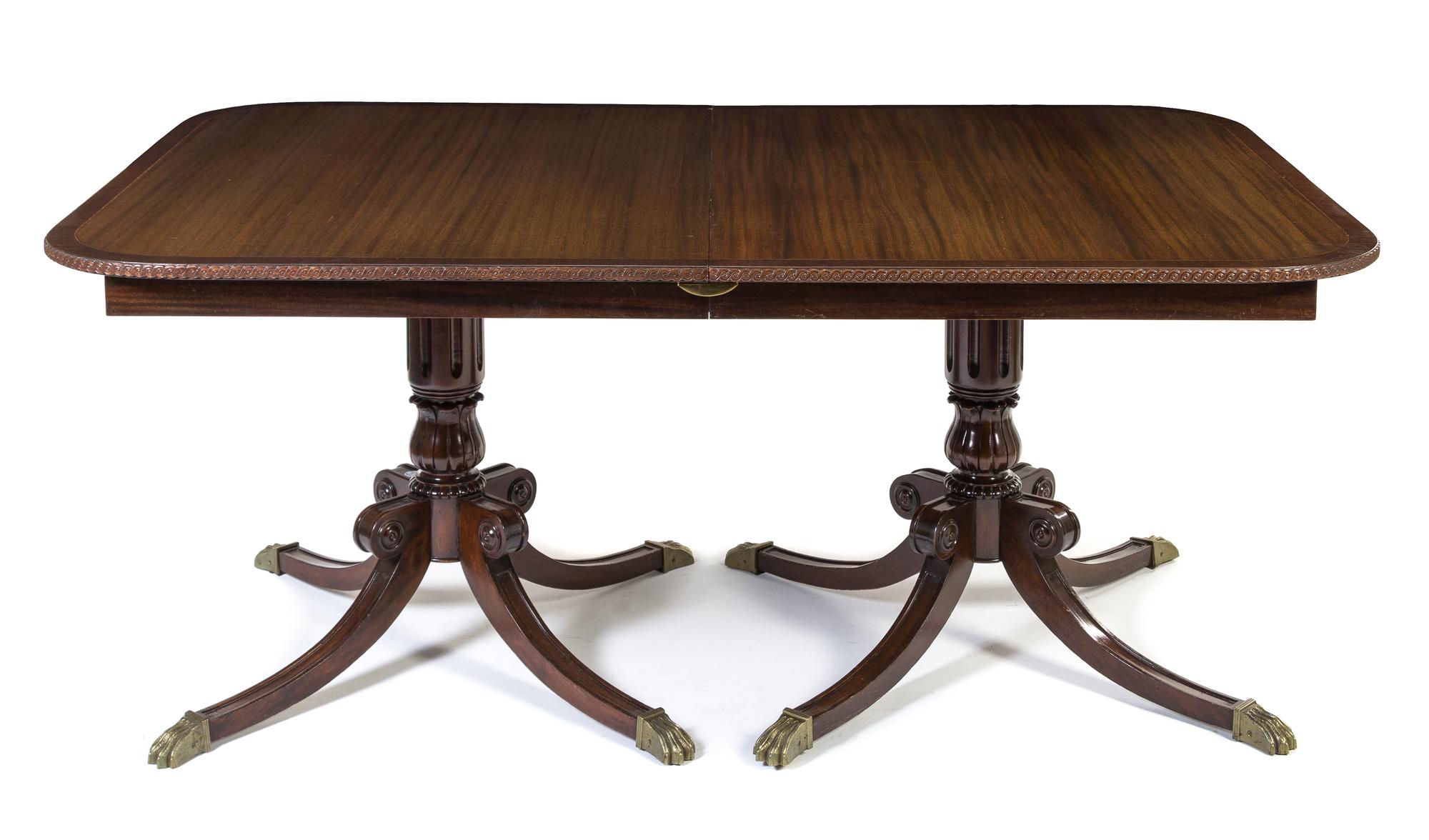 A Regency Style Double Pedestal Dining Table Height 32 x width 44 x depth 69 1/2 inches (closed).