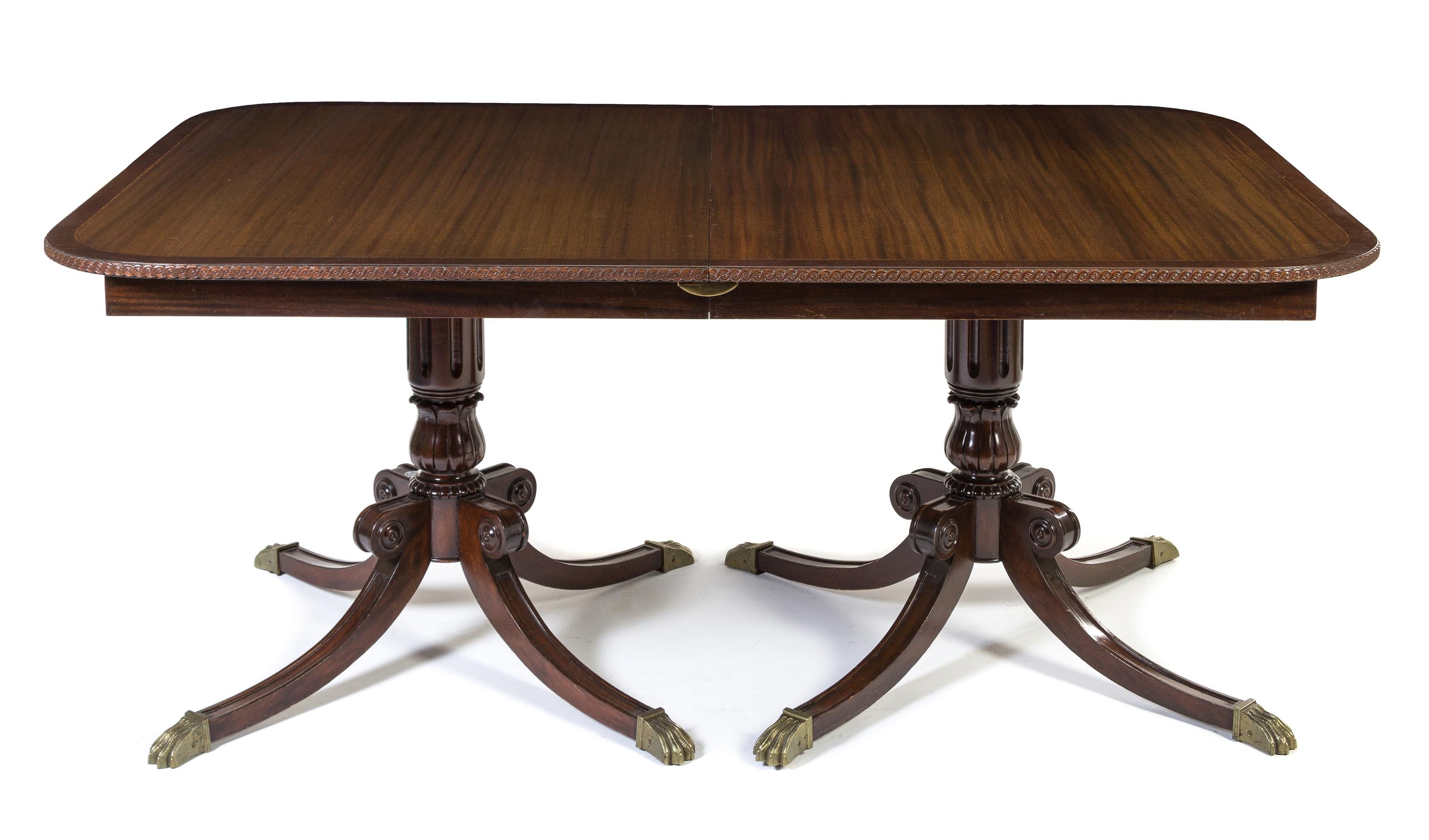 A Regency Style Double Pedestal Dining Table Height 32 x width 44 x depth 69 1/2 inches (closed).