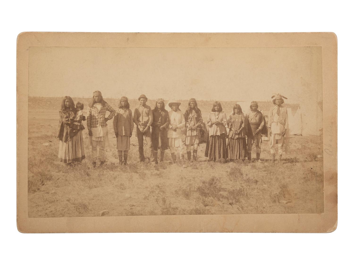 [NATIVE AMERICANS]. Boudoir photograph of Apache subjects, likely at San Carlos Indian Reservation, Arizona.