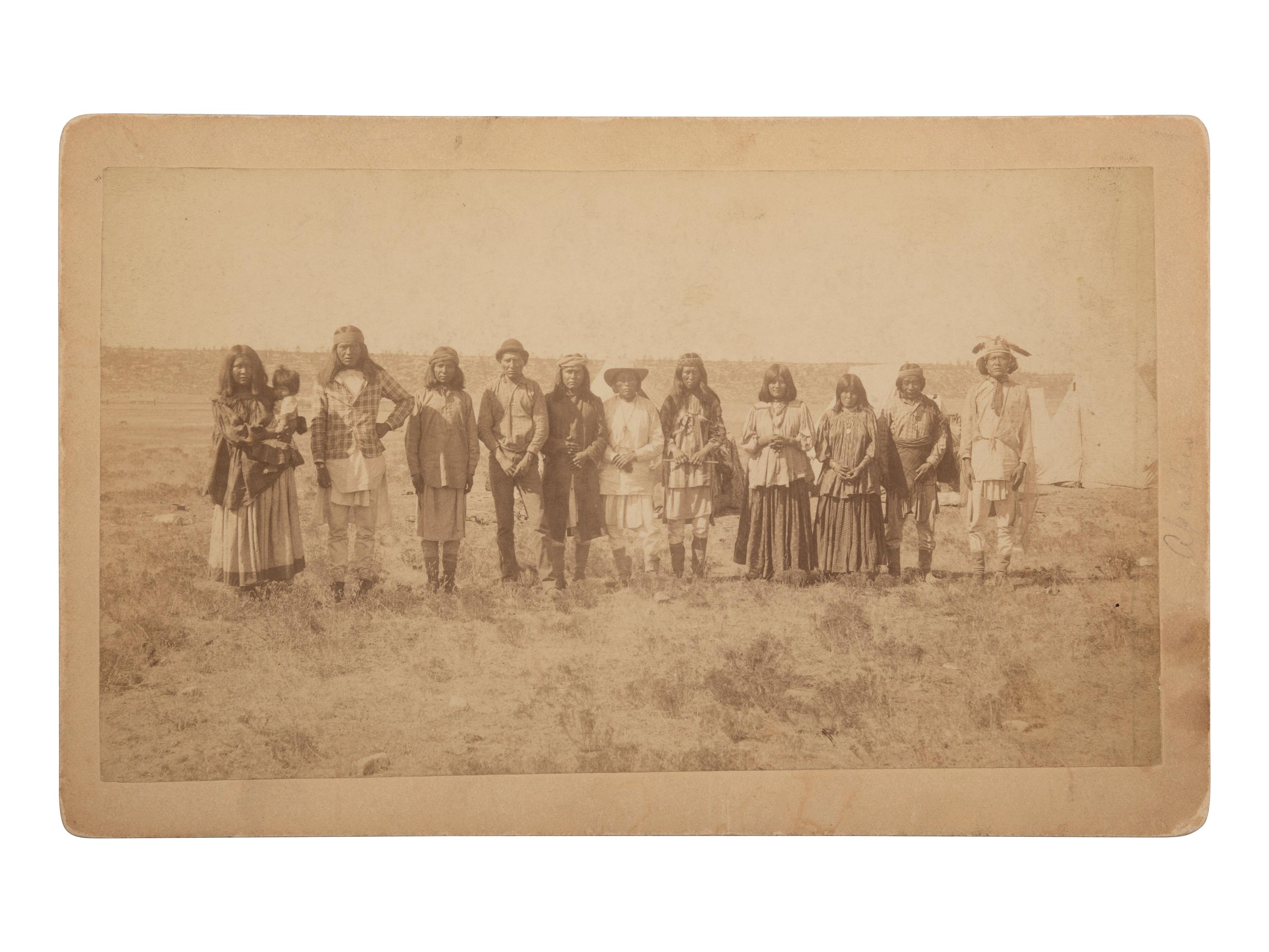 [NATIVE AMERICANS]. Boudoir photograph of Apache subjects, likely at San Carlos Indian Reservation, Arizona.