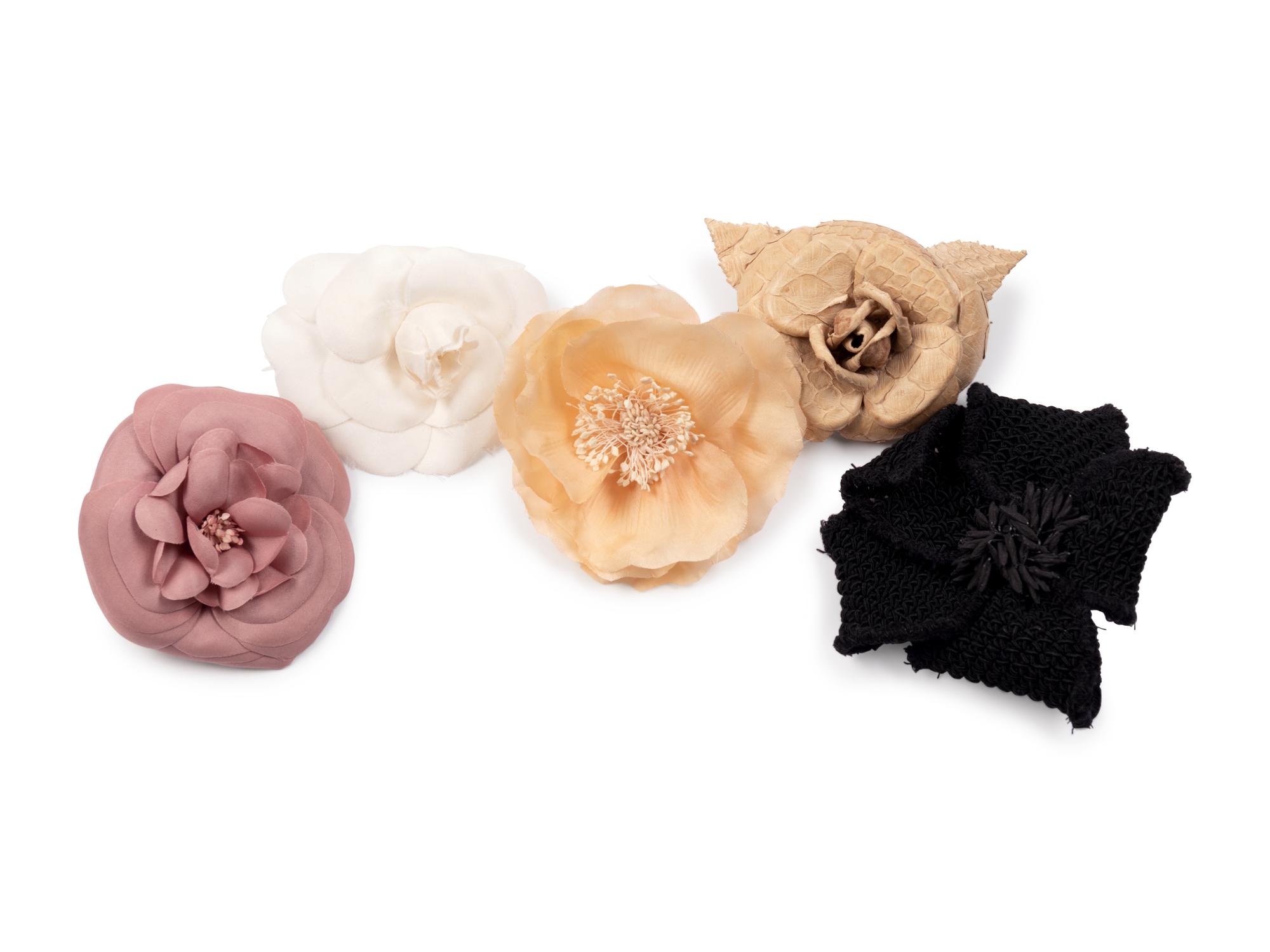 Six Chanel Brooches/Pins: Four Textile, One Snake Skin, One Metal