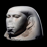 An Egyptian Limestone Canopic Jar Lid