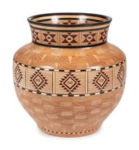 A Turned and Segmented Wood Vase in the style of Ray Allen