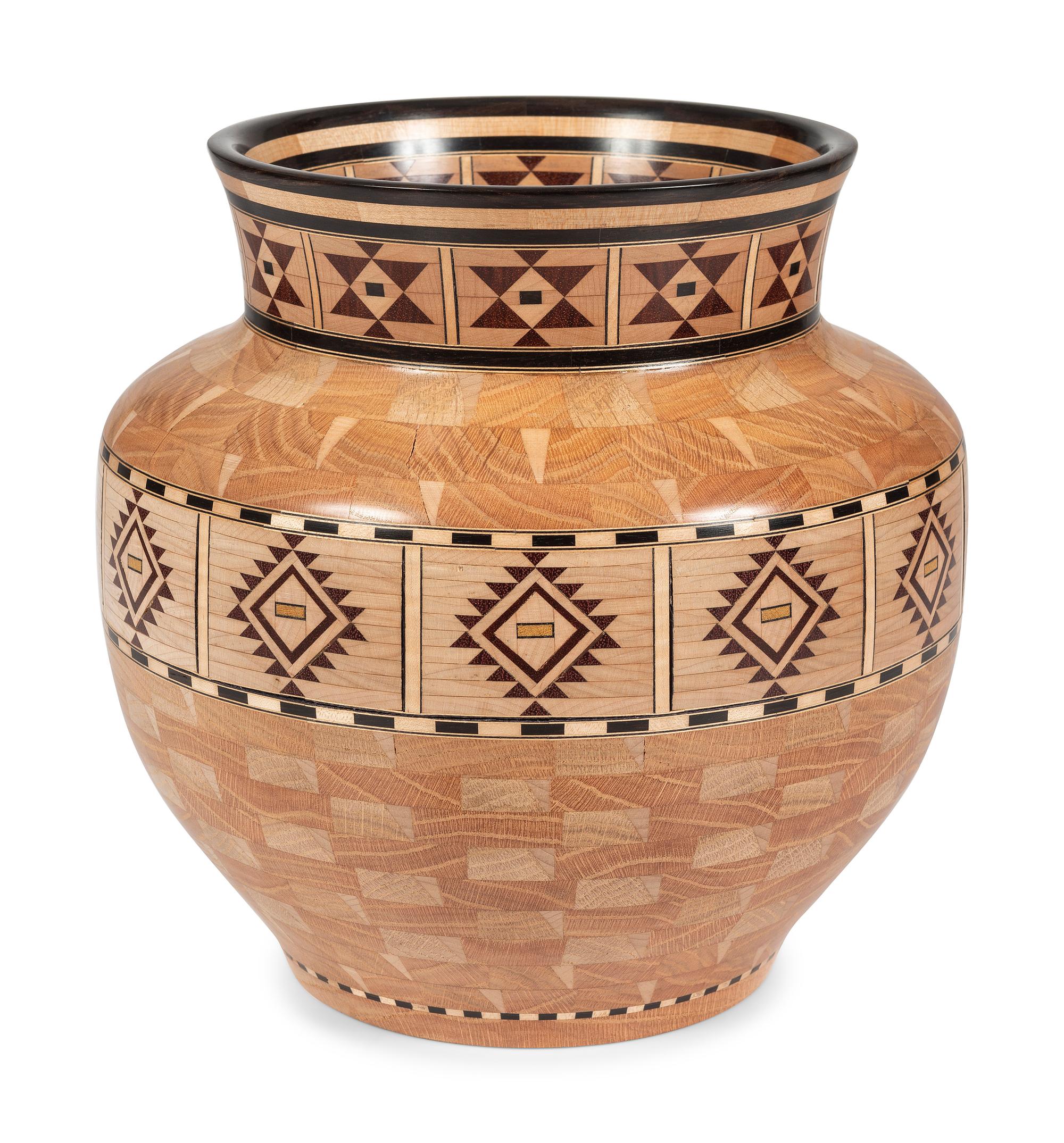 A Turned and Segmented Wood Vase in the style of Ray Allen