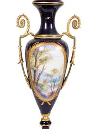 A Pair of Sèvres Style Gilt Metal Mounted Porcelain Covered Urns