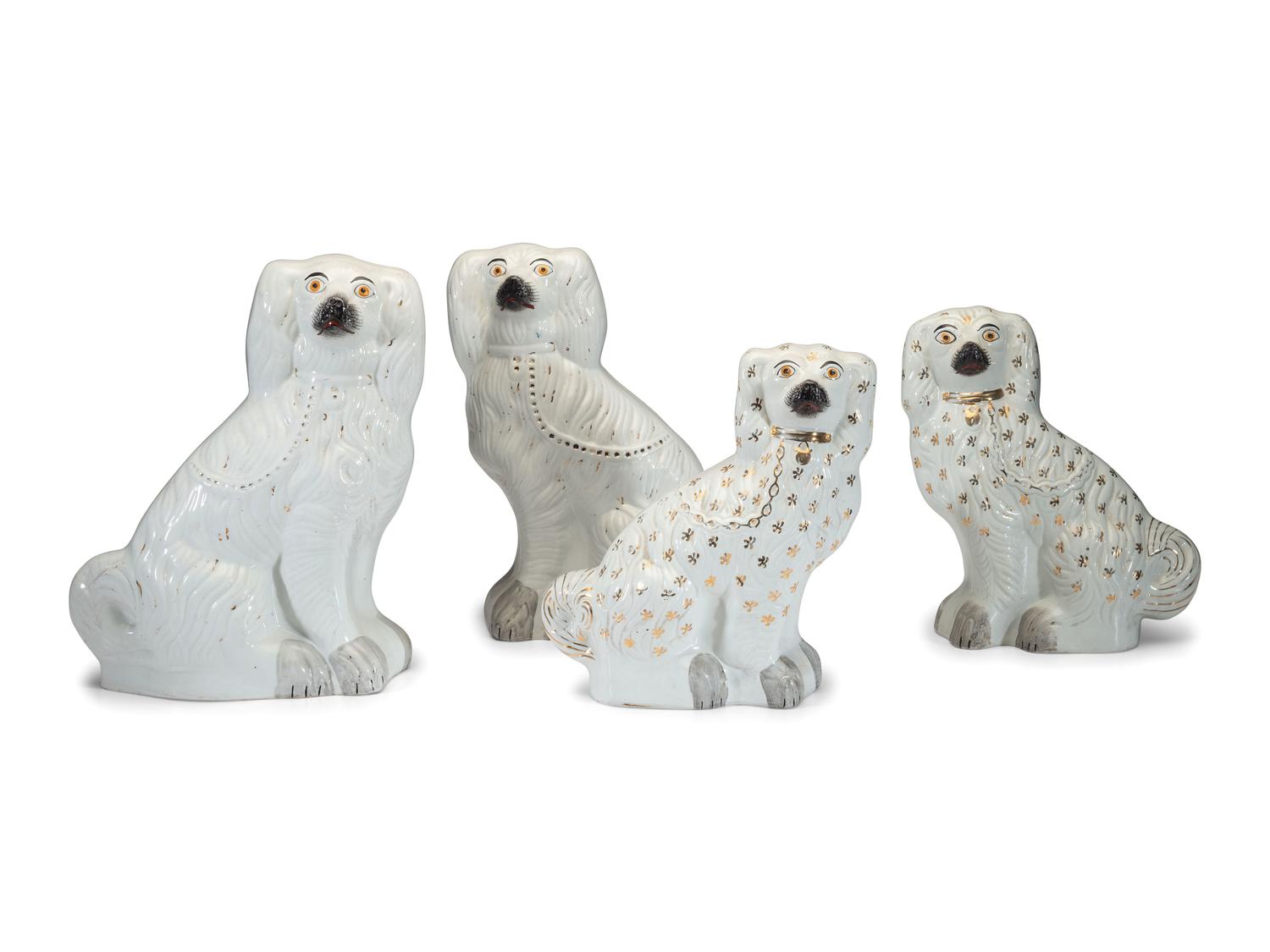 Four Staffordshire Spaniel Figures