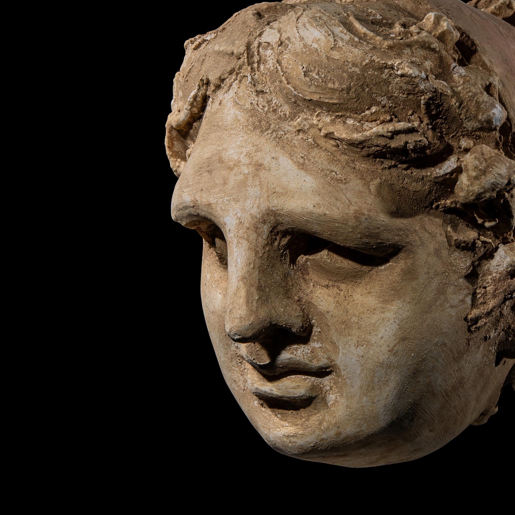 An Eastern Roman Stucco Head of a Woman