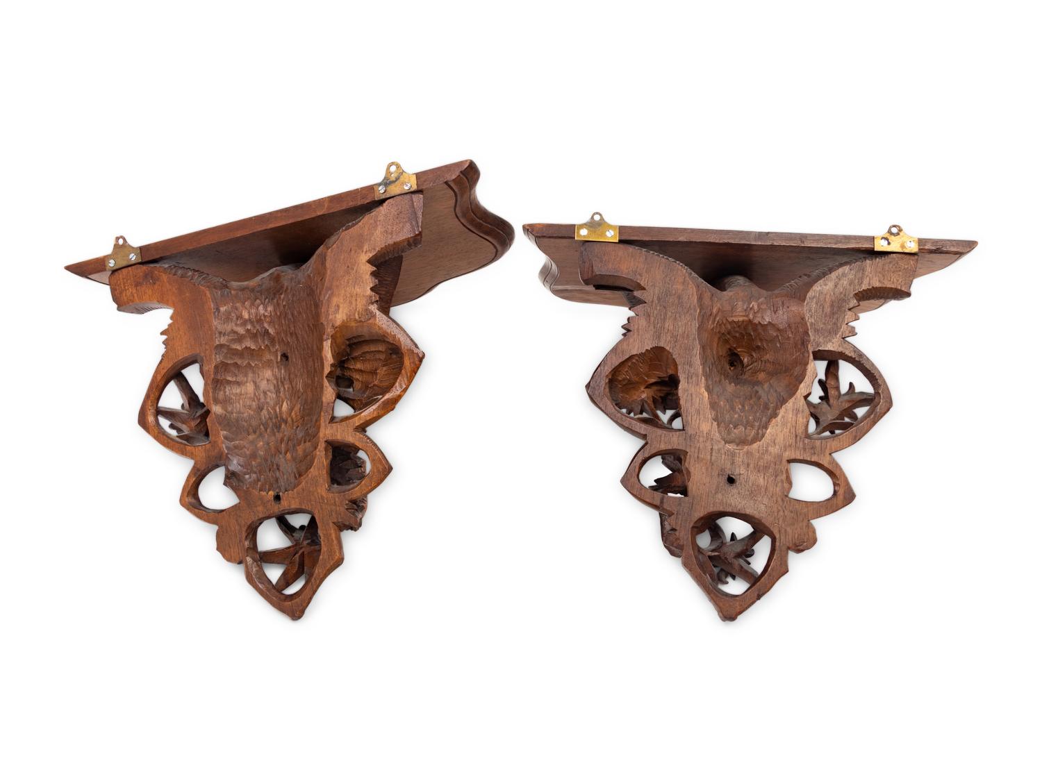 A Pair of Black Forest Style Carved Oak Wall Brackets