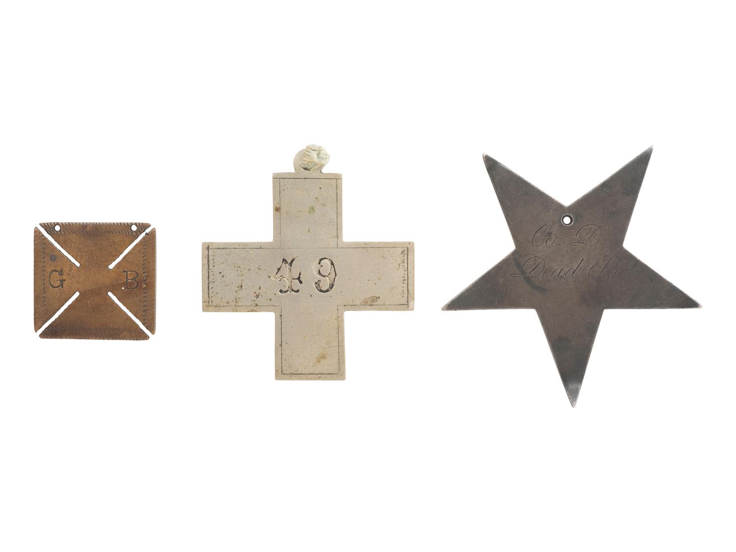 [MILITARIA]. Three Corps badges, one inscribed "Co. D, Dead Shot."