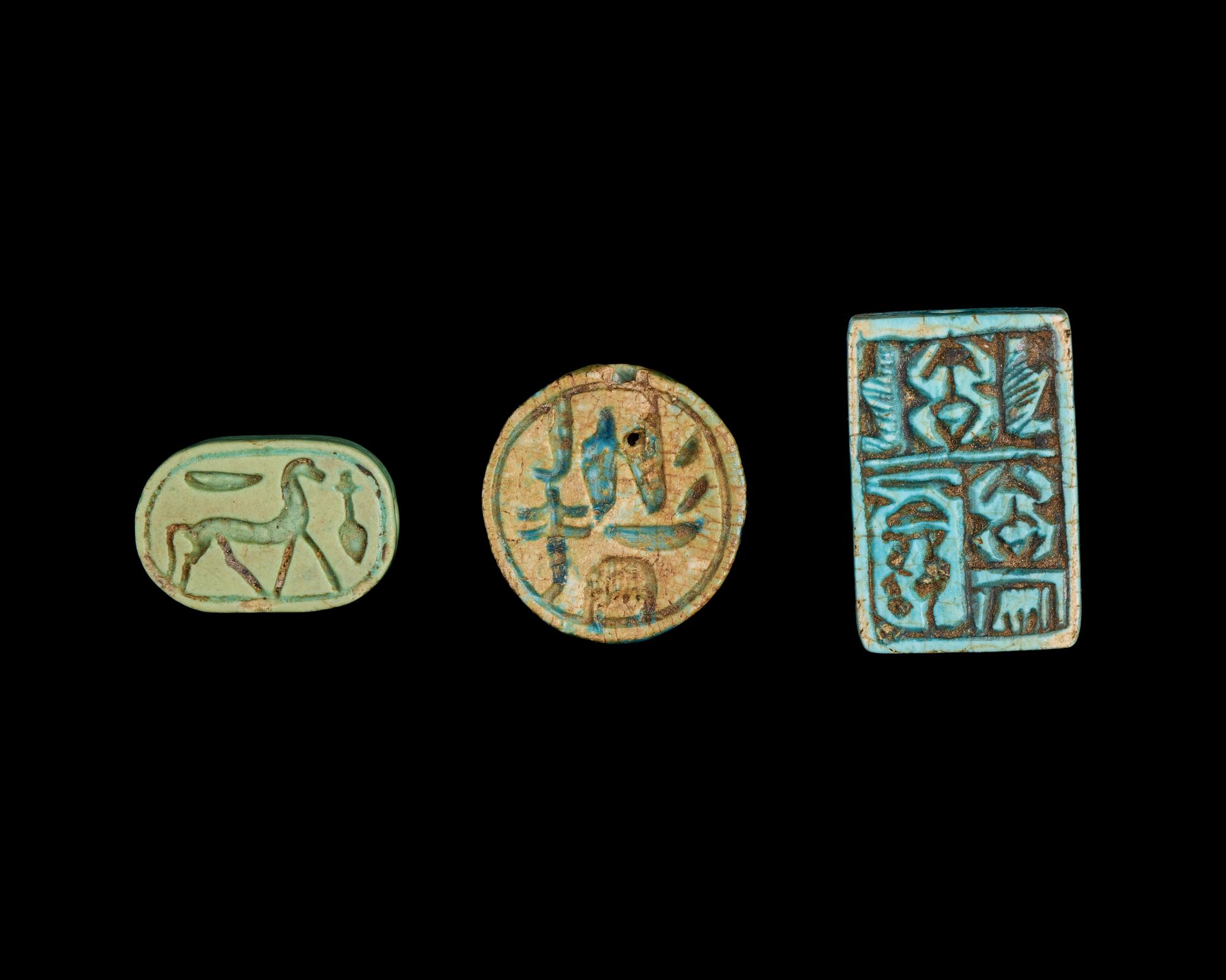 Two Egyptian Faience Seals and an Inscribed Bead