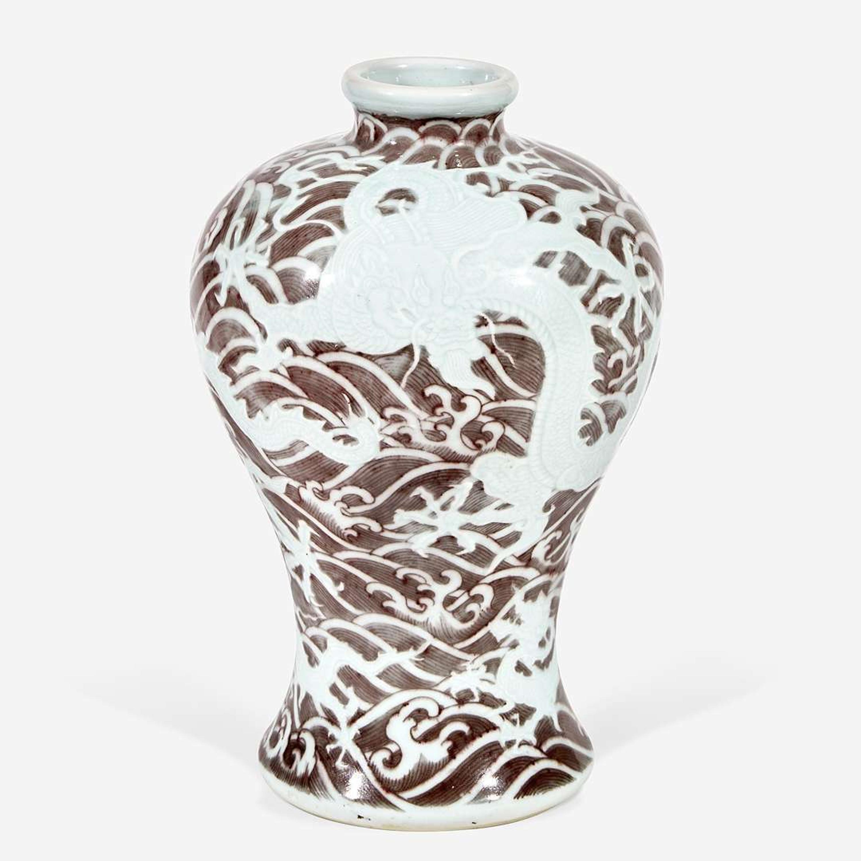 A Chinese carved and underglaze red "Dragons and Waves" vase, Meiping Yongzheng six-character mark and of the period