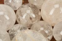A Continental Carved Wood Dough Bowl and a Collection of Rock Crystal Ornaments