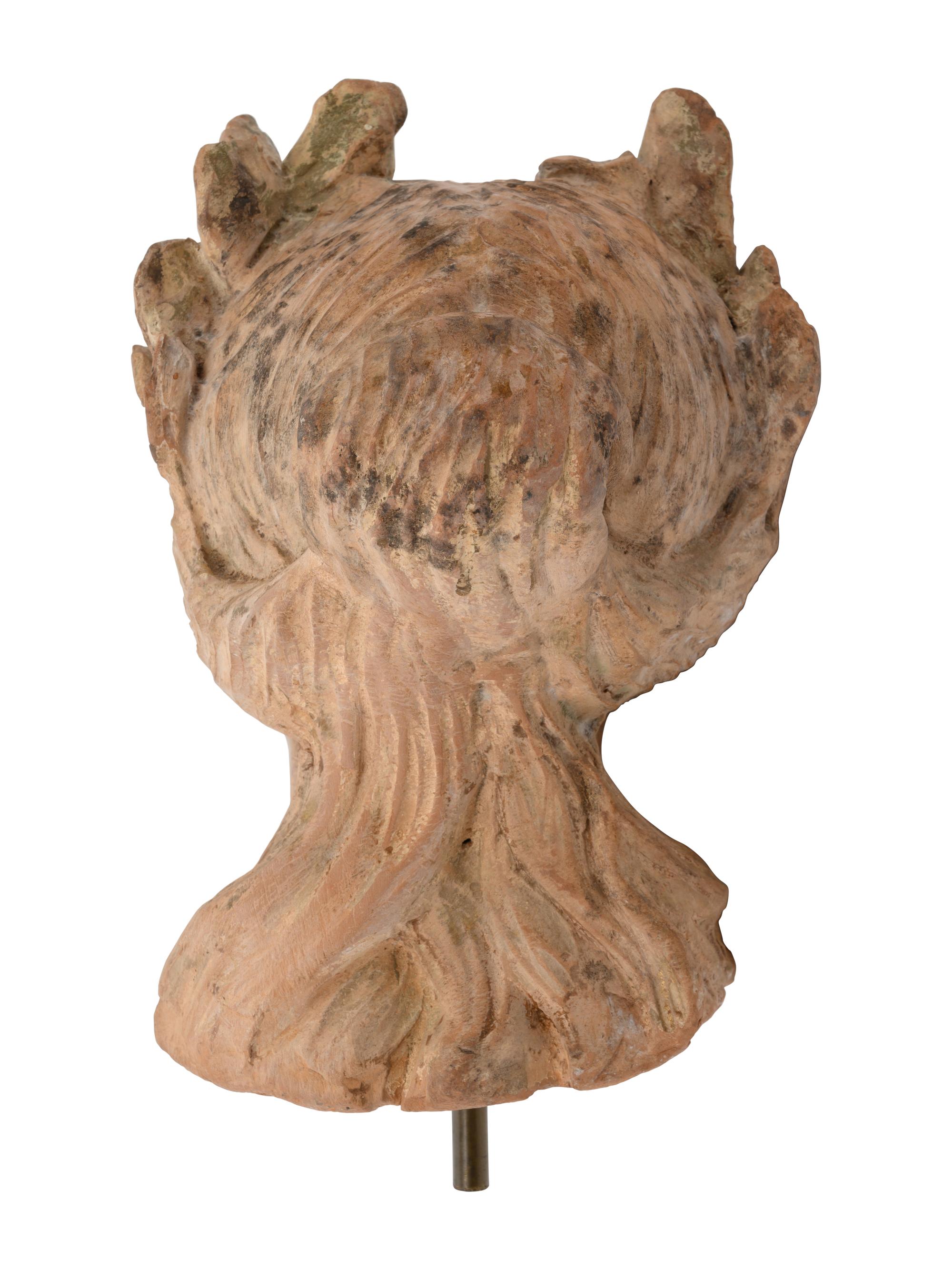 A Roman Style Terracotta Head of a Woman