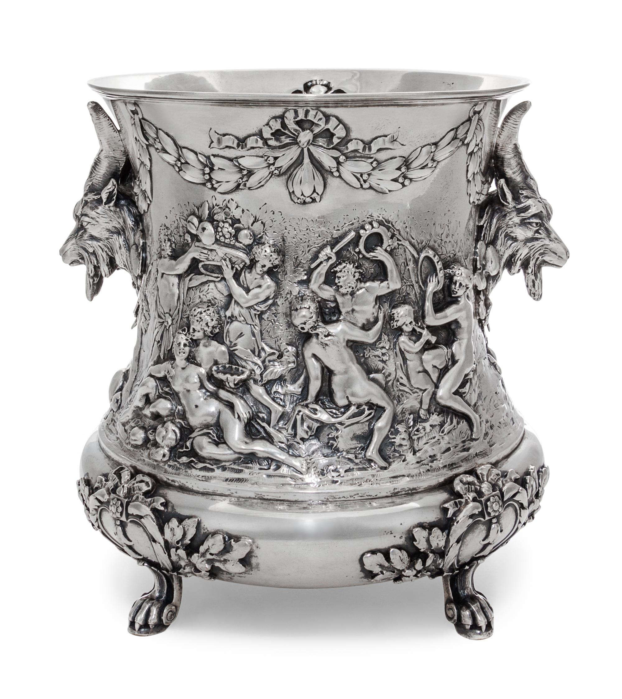 A German Silver Wine Cooler, Storck & Sinsheimer, Hanau, Early 20th Century, of campagna form, cast with a Bacchic merry-marking scenes