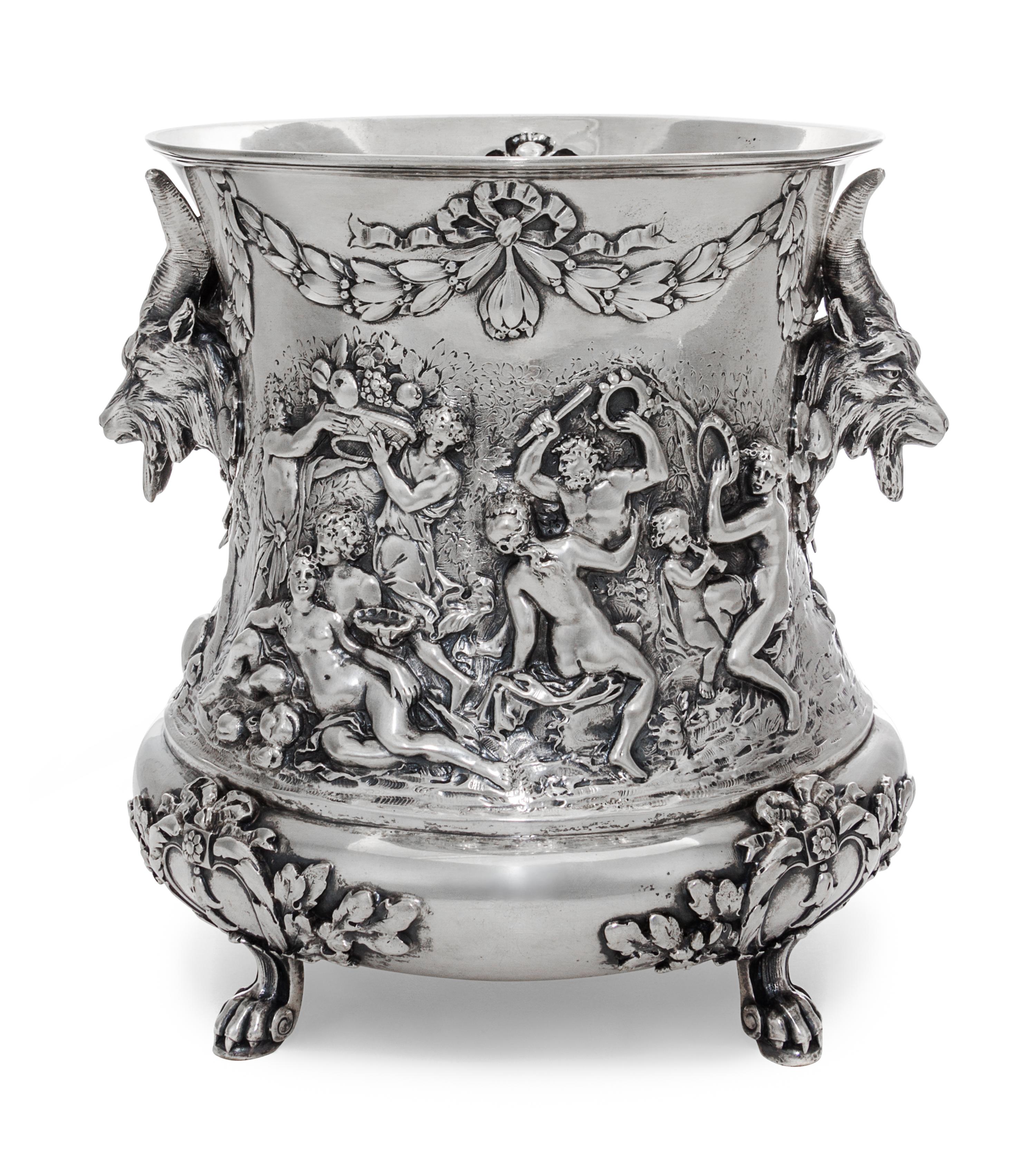 A German Silver Wine Cooler, Storck & Sinsheimer, Hanau, Early 20th Century, of campagna form, cast with a Bacchic merry-marking scenes